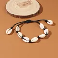 Braccialetto con conchiglie di ciprea stile spiaggia fatto a mano nero regolabile - Bracciale Singolo / Nero