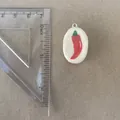 Detail view of hand-painted red chili pepper pendant with ruler for size reference - Oval Chili Pendant Only (Without Chain)