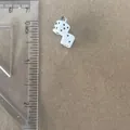 Macro view of white dice pendant charm with clear ruler showing its 0.75-inch size - Double Dice Pendant Only (Without Chain)