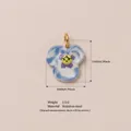 Floral pansy pendant in blue and yellow stainless steel with size markings - Clover Pendant