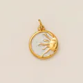 Detailed macro view of a gold-plated stainless steel sun and moon pendant with pearl inlay - Round Sun Face Pendant / Gold