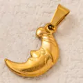 Close-up shot of golden stainless steel crescent moon pendant with a smiling face design - Smiling Moon Pendant / Gold