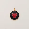 Macro view of a stainless steel round pendant with a red heart and black enamel finish - Guardian Heart Pendant