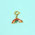 Close-up of a colorful enamel rainbow pendant with a cute smiley face design. - Rainbow Pendant