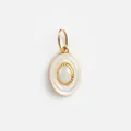 Detailed view of the iridescent opal stone and pearlescent oval frame of the pendant. - No. 26 White Round Tag Pendant