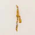 Macro detail of a golden Empire State Building charm with tiny NY initial pendants - Gold Building (YKXS260412173GK) / Gold