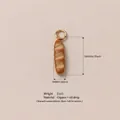 Miniature baguette pendant charm in copper with gold finish and oil drop detail. - Long Bread Pendant (YKXS26041265GK) / 1 Piece