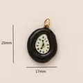 Detailed close-up view of melting clock pendant showing 25mm height and 17mm width - Surrealist Pendant / Black and White Melting Clock