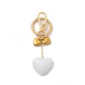 Elegant vintage gold metal and white resin heart-shaped bag charm and keychain detail - Triple Heart Keychain