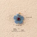 Detailed view of a light luxury blue flower copper pendant featuring a red zircon gemstone - Resin Blue Flower Pendant Only (Without Chain) / Blue