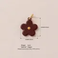 Dark brown flower charm pendant made of copper material with 14mm size and 2.8g weight - Dark Brown Yellow Core Flower Pendant
