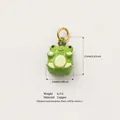 Detailed view of a green enamel frog charm with dimensions 17x10mm and 6.5g weight - Style 6 Crown Frog Pendant