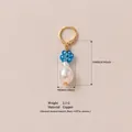 Gold-plated copper earring with blue flower charm and baroque pearl drop - Blue Flower Pearl Combination Pendant