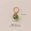 Handmade green floral glass bead pendant hoop earring with copper and 18K gold finish - Green White Flower Glass Bead Pendant