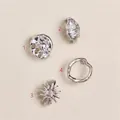 Set mit 4 silbernen Strand-Charms inklusive Sonnen- und Muscheldesign für Sandalen - Unregelmäßiger Runder Anhänger / 1 Stück / Silber
