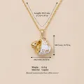 Vista dettagliata della collana con pendente a forma di cucciolo in tazza dorata - Cucciolo in Tazza / Oro