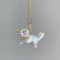 Close-up of a whimsical cat pendant necklace made from iridescent baroque pearls - Unique Cat Style (JPNK253005Z) / Gold