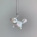 Macro close-up of a cute iridescent pearl cat pendant necklace with crystal ears - Unique Cat Style (JPNK253005Z) / Steel