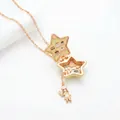 Golden star locket necklace featuring a miniature cake shop scene inside with a chef girl charm - Yellow Star Openable Style (Little Girl) / Pink Gold