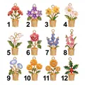 Selection of twelve distinct gold-toned birth month flower charms with enamel details - January Flower Pendant