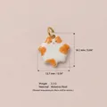 Detail view of fat cat charm with dimensions 16.2mm by 13.7mm in stainless steel - Orange and White Cat Pendant