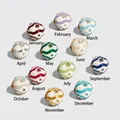 Twelve months birthstone beads for DIY jewelry with wavy enamel patterns and gems - January Drop Charm