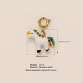 Ciondolo unicorno arcobaleno in acciaio con dimensioni, peso 3,7 g e placcatura oro. - Unicorno