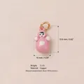 Detail showing a pink doll pendant charm with copper material and size measurements - Pink Humanoid Pendant