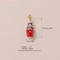 Macro detail view of a copper Matryoshka doll charm with precise size and weight dimensions - Red Humanoid White Scarf Pendant