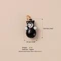 Detailed close-up view of a cute black doll pendant with size and weight specifications. - Black Humanoid Pendant (11)