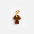 Macro view of a brown resin mushroom charm with a high-quality gold spring clasp accessory - Mushroom Pendant / Amber Brown