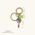 Elegant gold keychain featuring a colorful rhinestone tennis racket and mini tennis ball - Gradient Rhinestone Style / Pink