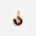 Detailed view of a stylish amber resin hook pendant with gold stainless steel clasp - U-Shaped Pendant / Amber Brown