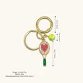 Elegant tennis racket bag charm featuring a heart design and pearl accents for handbags - Pearl Edge Heart / Green