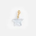 Detailed view of a light blue translucent resin star pendant with a gold lobster clasp. - Star Pendant / Light Blue