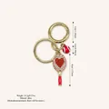 Sweet tennis racket bag pendant with heart rhinestone design and a red ball charm - Red Handle Heart Style / Light Pink