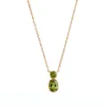 Detailed view of gold gourd necklace featuring olive green bezel-set stones. - August Peridot (Gold)