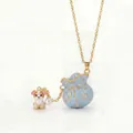 Detailed macro view of enamel lucky bag necklace with cute puppy charm and pearl accent - Light Blue Lucky Bag Dog Necklace