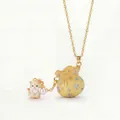 Detail of enamel lucky bag pendant with cute cat charm and pearl on gold chain - Yellow Lucky Bag Cat Necklace