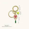 Tennis racket keychain with pearl heart design and lime green ball in gold alloy - Green