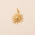 Detail shot of a polished gold stainless steel sun pendant featuring a smiling face design - Anthropomorphic Sun Face Pendant