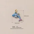 Detail view of blue floral dolphin pendant with dimensions and stainless steel material - Shark Pendant Only (Without Chain) / 16x12mm / Light Blue/Multicolor Print