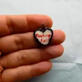 Stainless steel heart pendant featuring a bold Fucking Hell printed design on white - Letter Print Pendant / White Heart Black Wrap (Fucking hell)
