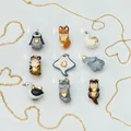 Collection of nine cute animal charms including penguin, fox, and tiger with gold hearts. - Penguin Style (1)