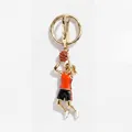 Gold-tone enamel female basketball player keychain charm with red jersey and sparkling ball. - Red and Black Basketball Athlete Style (XCBS262309SI)