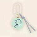 Close-up view of mint green flower-shaped tag featuring a blue ping-pong paddle print - Table Tennis Pendant