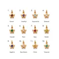 Detailed view of twelve gold-plated star pendants with different colored birthstones - Star Birthstone Pendant / January