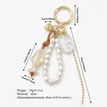 Elegant koi fish and pearl bead bag charm keychain in golden alloy finish - Golden Koi Fish Charm