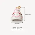 Detailed macro view of a 3-tier cake pendant charm in copper showing dimensions and weight. - Triple Layer Cake Pendant