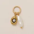 Close-up of gold hoop pendant with baroque pearl and grey pearl in organic nest - Shell Long Pearl Pendant / Gold/White